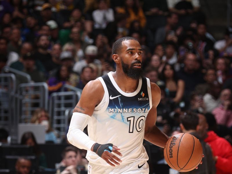 LOS ANGELES, CA - FEBRUARY 27: Mike Conley #10 of the Minnesota Timberwolves dribbles the ball during the game against the Los Angeles Lakers on February 27, 2025 at Crypto.Com Arena in Los Angeles, California. NOTE TO USER: User expressly acknowledges and agrees that, by downloading and/or using this Photograph, user is consenting to the terms and conditions of the Getty Images License Agreement. Mandatory Copyright Notice: Copyright 2025 NBAE (Photo by Nathaniel S. Butler/NBAE via Getty Images)