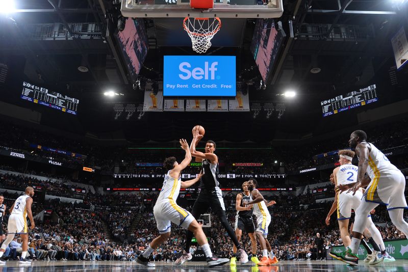 SAN ANTONIO, TX - MARCH 11:  Victor Wembanyama #1 of the San Antonio Spurs handles the ball during the game against the Golden State Warriors on March 11, 2024 at the Frost Bank Center in San Antonio, Texas. NOTE TO USER: User expressly acknowledges and agrees that, by downloading and or using this photograph, user is consenting to the terms and conditions of the Getty Images License Agreement. Mandatory Copyright Notice: Copyright 2024 NBAE (Photos by Michael Gonzales/NBAE via Getty Images)