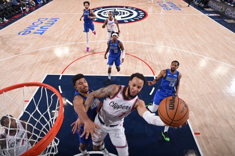 INGLEWOOD, CA - OCTOBER 14: Amir Coffey #7 of the LA Clippers drives to the basket during the game against the Dallas Mavericks on October 14, 2024 at Intuit Dome in Los Angeles, California. NOTE TO USER: User expressly acknowledges and agrees that, by downloading and/or using this Photograph, user is consenting to the terms and conditions of the Getty Images License Agreement. Mandatory Copyright Notice: Copyright 2024 NBAE (Photo by Juan Ocampo/NBAE via Getty Images)