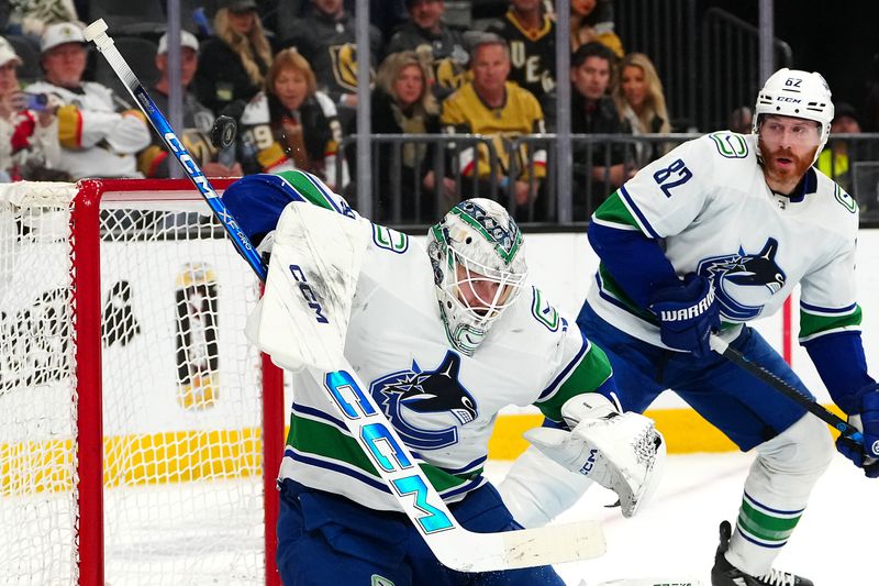 Mar 7, 2024; Las Vegas, Nevada, USA; Vancouver Canucks goaltender Thatcher Demko (35) makes a save against the Vegas Golden Knights during the second period at T-Mobile Arena. Mandatory Credit: Stephen R. Sylvanie-USA TODAY Sports