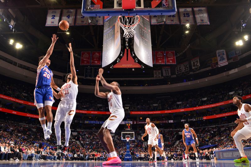 PHILADELPHIA, PA - NOVEMBER 13: Jared McCain #20 of the Philadelphia 76ers drives to the basket during the game against the Cleveland Cavaliers on November 13, 2024 at the Wells Fargo Center in Philadelphia, Pennsylvania NOTE TO USER: User expressly acknowledges and agrees that, by downloading and/or using this Photograph, user is consenting to the terms and conditions of the Getty Images License Agreement. Mandatory Copyright Notice: Copyright 2024 NBAE (Photo by Jesse D. Garrabrant/NBAE via Getty Images)