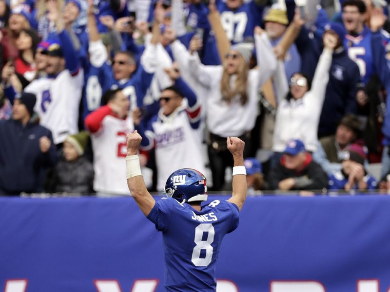 New York Giants quarterback Daniel Jones (8) reacts after throwing a touchdown pass against the Houston Texans during an NFL football game Sunday, Nov. 13, 2022, in East Rutherford, N.J. (AP Photo/Adam Hunger)