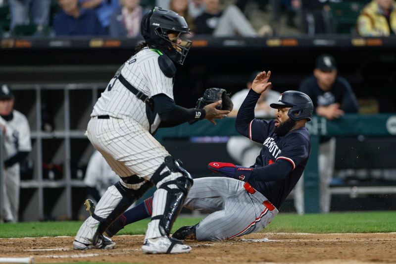 Apr 30, 2024; Chicago, Illinois, USA; Minnesota Twins outfielder Manuel Margot (13) scores against the Chicago White Sox during the eight inning at Guaranteed Rate Field. Mandatory Credit: Kamil Krzaczynski-USA TODAY Sports