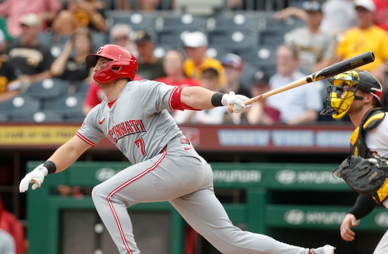 Aug 25, 2024; Pittsburgh, Pennsylvania, USA; Cincinnati Reds left fielder Spencer Steer (7) hits a single against the Pittsburgh Pirates during the sixth inning at PNC Park. Mandatory Credit: Charles LeClaire-USA TODAY Sports