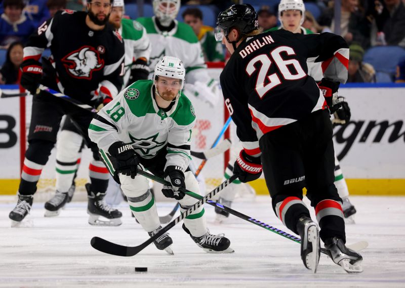 Feb 6, 2024; Buffalo, New York, USA;  Buffalo Sabres defenseman Rasmus Dahlin (26) looks to make a pass as Dallas Stars center Sam Steel (18) defends during the third period at KeyBank Center. Mandatory Credit: Timothy T. Ludwig-USA TODAY Sports