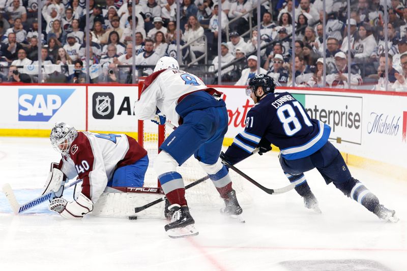 Apr 30, 2024; Winnipeg, Manitoba, CAN; Winnipeg Jets left wing Kyle Connor (81) tries to get a rebound after a save by Colorado Avalanche goaltender Alexandar Georgiev (40) in the second period in game five of the first round of the 2024 Stanley Cup Playoffs at Canada Life Centre. Mandatory Credit: James Carey Lauder-USA TODAY Sports