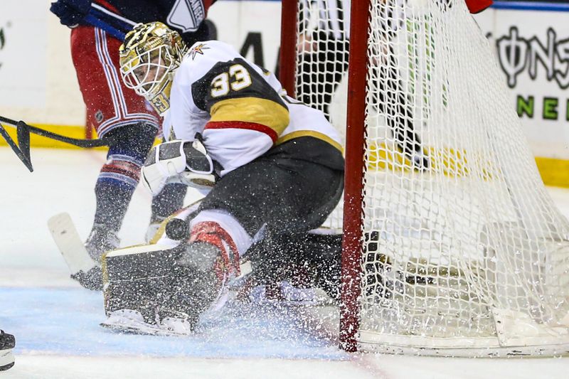 Jan 26, 2024; New York, New York, USA; Vegas Golden Knights goaltender Adin Hill (33) makes a save on a shot on goal attempt in the second period against the New York Rangers at Madison Square Garden. Mandatory Credit: Wendell Cruz-USA TODAY Sports