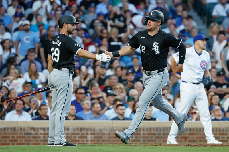 Jun 5, 2024; Chicago, Illinois, USA; Chicago White Sox outfielder Gavin Sheets (32) celebrates with shortstop Paul DeJong (29) after scoring against the Chicago Cubs during the fourth inning at Wrigley Field. Mandatory Credit: Kamil Krzaczynski-USA TODAY Sports