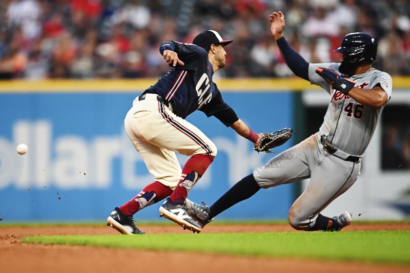 Jul 22, 2024; Cleveland, Ohio, USA; Detroit Tigers right fielder Wenceel Perez (46) steals second as Cleveland Guardians second baseman Tyler Freeman (2) misses the ball during the eighth inning at Progressive Field. Mandatory Credit: Ken Blaze-USA TODAY Sports