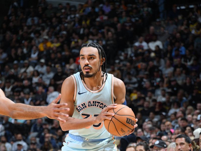 SAN ANTONIO, TX - NOVEMBER 27: Tre Jones #33 of the San Antonio Spurs handles the ball during the game against the Los Angeles Lakers on November 27, 2024 at the Frost Bank Center in San Antonio, Texas. NOTE TO USER: User expressly acknowledges and agrees that, by downloading and or using this photograph, user is consenting to the terms and conditions of the Getty Images License Agreement. Mandatory Copyright Notice: Copyright 2024 NBAE (Photos by Michael Gonzales/NBAE via Getty Images)