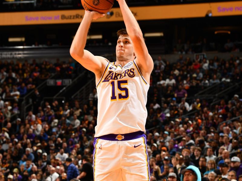 PHOENIX, AZ - NOVEMBER 26: Austin Reaves #15 of the Los Angeles Lakers shoots the ball during the game against the Phoenix Suns during the Emirates NBA Cup game on November 26, 2024 at Footprint Center in Phoenix, Arizona. NOTE TO USER: User expressly acknowledges and agrees that, by downloading and or using this photograph, user is consenting to the terms and conditions of the Getty Images License Agreement. Mandatory Copyright Notice: Copyright 2024 NBAE (Photo by Barry Gossage/NBAE via Getty Images)
