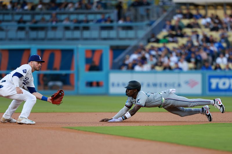 May 6, 2024; Los Angeles, California, USA;  Miami Marlins outfielder Jazz Chisholm Jr. (2) steals second base during the first inning against the Los Angeles Dodgers at Dodger Stadium. Mandatory Credit: Kiyoshi Mio-USA TODAY Sports