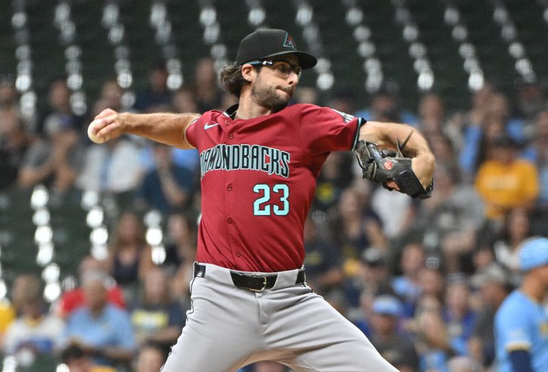 Sep 20, 2024; Milwaukee, Wisconsin, USA; Arizona Diamondbacks pitcher Zac Gallen (23) delivers a pitch against the Milwaukee Brewers in the first inning  at American Family Field. Mandatory Credit: Michael McLoone-Imagn Images