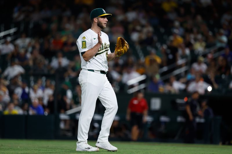 Sep 23, 2025; West Sacramento, California, USA; Athletics pitcher Justin Sterner (60) reacts after an out during the eighth inning against the Houston Astros at Sutter Health Park. Mandatory Credit: Sergio Estrada-Imagn Images