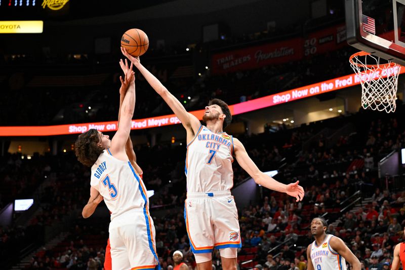 PORTLAND, OREGON - MARCH 06: Chet Holmgren #7 of the Oklahoma City Thunder grabs a rebound during the first quarter of the game against the Portland Trail Blazers at the Moda Center on March 06, 2024 in Portland, Oregon. NOTE TO USER: User expressly acknowledges and agrees that, by downloading and or using this photograph, User is consenting to the terms and conditions of the Getty Images License Agreement. (Photo by Alika Jenner/Getty Images)