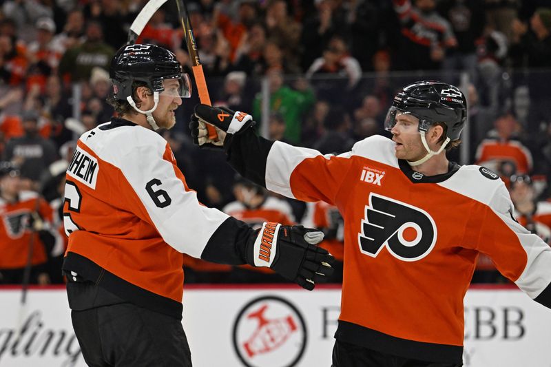 Jan 6, 2026; Philadelphia, Pennsylvania, USA; Philadelphia Flyers defenseman Travis Sanheim (6) celebrates his goal with defenseman Cam York (8) against the Anaheim Ducks during the second period at Xfinity Mobile Arena. Mandatory Credit: Eric Hartline-Imagn Images