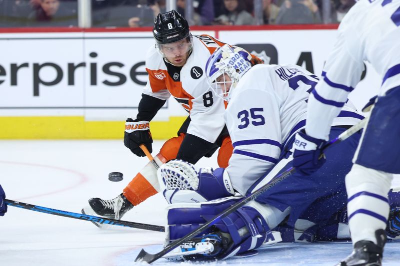 Jan 8, 2026; Philadelphia, Pennsylvania, USA; Philadelphia Flyers defenseman Cam York (8) shoots the puck against Toronto Maple Leafs goaltender Dennis Hildeby (35) during the first period at Xfinity Mobile Arena. Mandatory Credit: Bill Streicher-Imagn Images