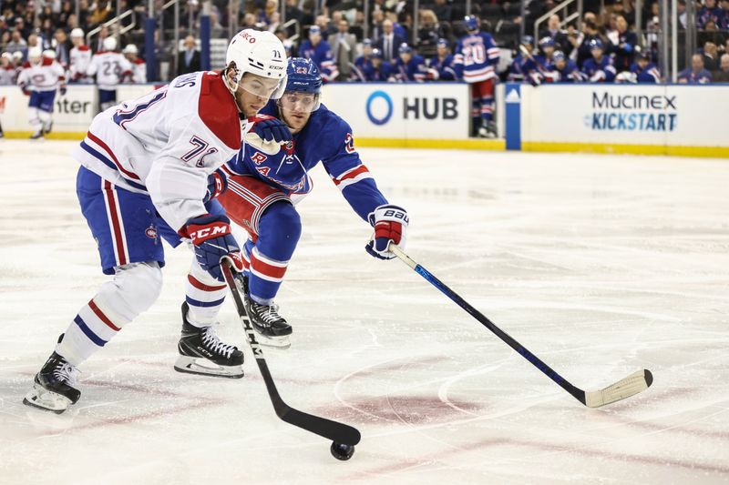 Apr 7, 2024; New York, New York, USA;  Montreal Canadiens center Jake Evans (71) and New York Rangers defenseman Adam Fox (23) chase the puck in the third period at Madison Square Garden. Mandatory Credit: Wendell Cruz-USA TODAY Sports