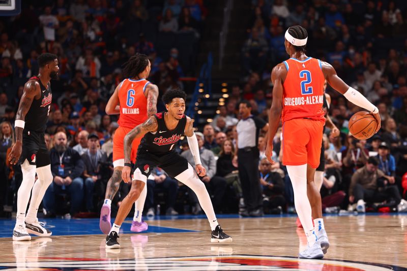 OKLAHOMA CITY, OK - JANUARY 23: Shai Gilgeous-Alexander #2 of the Oklahoma City Thunder handles the ball against defender Anfernee Simons #1 of the Portland Trail Blazers during the game on January 23, 2024 at Paycom Arena in Oklahoma City, Oklahoma. NOTE TO USER: User expressly acknowledges and agrees that, by downloading and or using this photograph, User is consenting to the terms and conditions of the Getty Images License Agreement. Mandatory Copyright Notice: Copyright 2024 NBAE (Photo by Zach Beeker/NBAE via Getty Images)