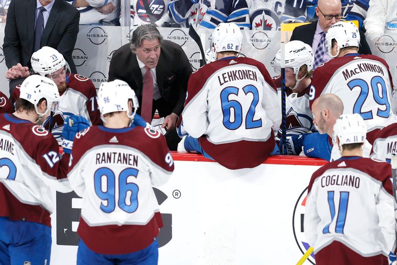 Apr 30, 2024; Winnipeg, Manitoba, CAN; Colorado Avalanche head coach Jared Bednar talks with players during a break in play in the third period against the Winnipeg Jets in game five of the first round of the 2024 Stanley Cup Playoffs at Canada Life Centre. Mandatory Credit: James Carey Lauder-USA TODAY Sports