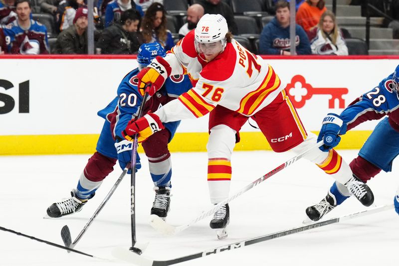 Dec 11, 2023; Denver, Colorado, USA; Colorado Avalanche center Ross Colton (20) defends on Calgary Flames center Martin Pospisil (76) in the third period at Ball Arena. Mandatory Credit: Ron Chenoy-USA TODAY Sports