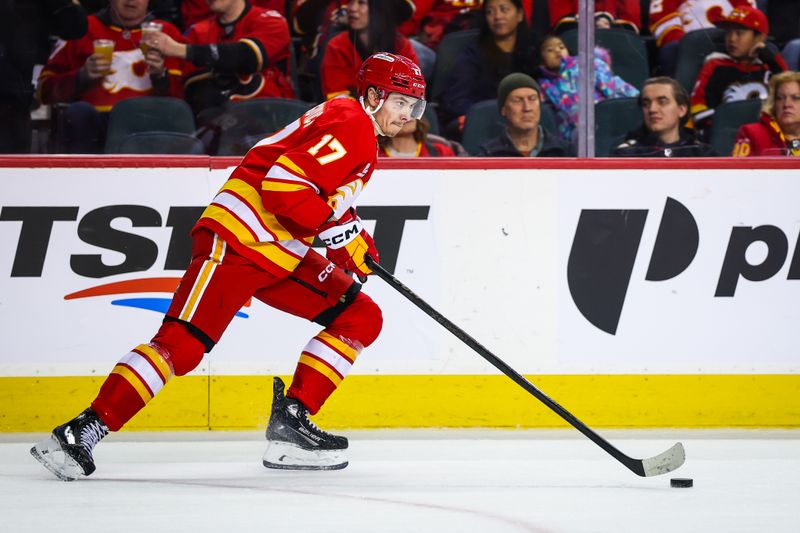 Jan 23, 2026; Calgary, Alberta, CAN; Calgary Flames center Yegor Sharangovich (17) skates with the puck against the Washington Capitals during the third period at Scotiabank Saddledome. Mandatory Credit: Sergei Belski-Imagn Images