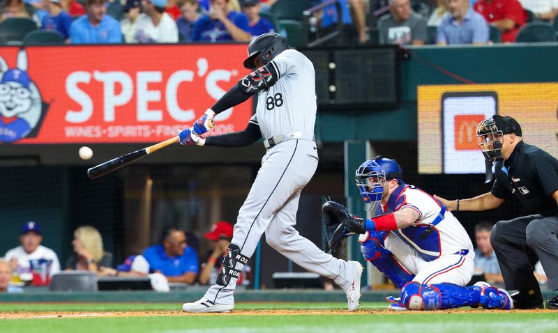 Jul 24, 2024; Arlington, Texas, USA; Chicago White Sox center fielder Luis Robert Jr. (88) hits a home run during the third inning against the Texas Rangers at Globe Life Field. Mandatory Credit: Kevin Jairaj-USA TODAY Sports