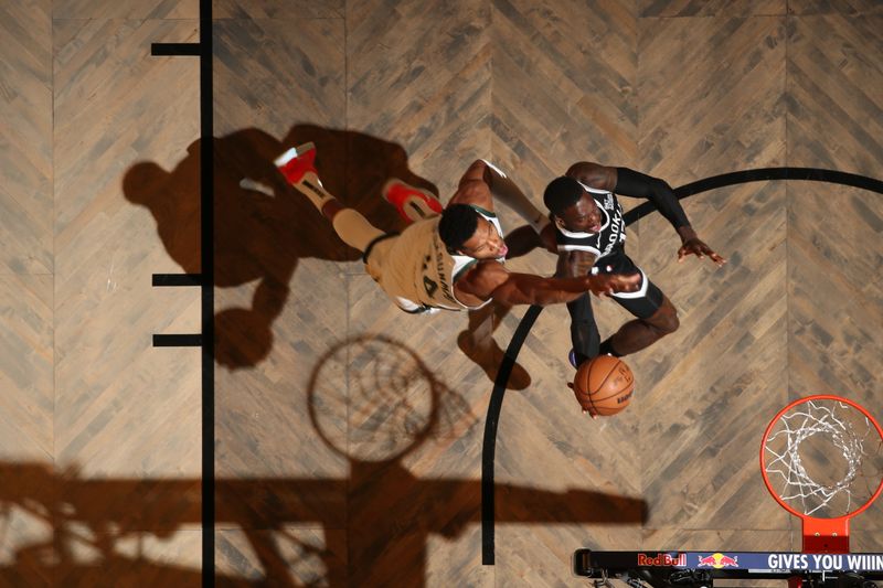 BROOKLYN, NY - OCTOBER 27: Dennis Schroder #17 of the Brooklyn Nets drives to the basket during the game against the Milwaukee Bucks on October 27, 2024 at Barclays Center in Brooklyn, New York. NOTE TO USER: User expressly acknowledges and agrees that, by downloading and or using this Photograph, user is consenting to the terms and conditions of the Getty Images License Agreement. Mandatory Copyright Notice: Copyright 2024 NBAE (Photo by Nathaniel S. Butler/NBAE via Getty Images)