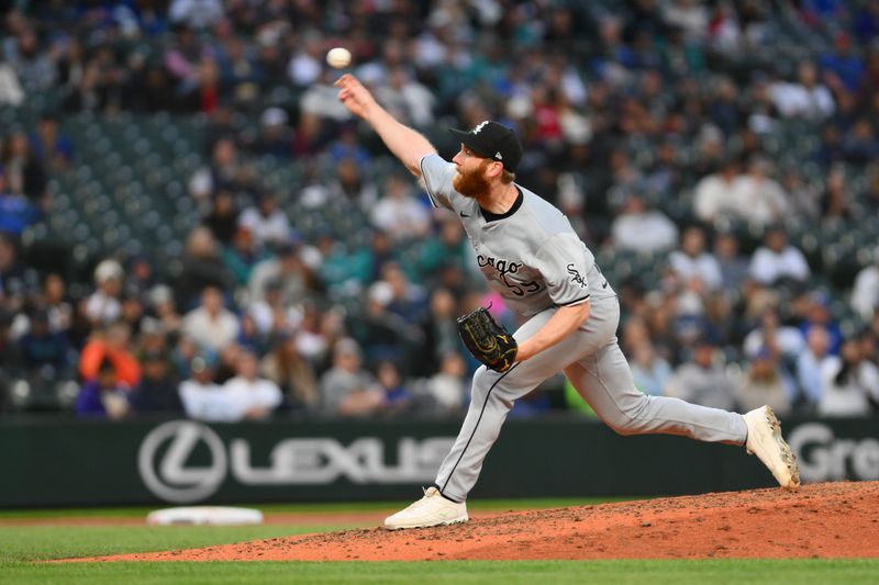 Jun 11, 2024; Seattle, Washington, USA; Chicago White Sox relief pitcher John Brebbia (59) pitches to the Seattle Mariners during the seventh inning at T-Mobile Park. Mandatory Credit: Steven Bisig-USA TODAY Sports