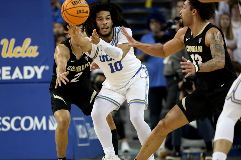 Jan 14, 2023; Los Angeles, California, USA; UCLA Bruins guard Tyger Campbell (10) passes the ball during the first half against the Colorado Buffaloes at Pauley Pavilion presented by Wescom. Mandatory Credit: Kiyoshi Mio-USA TODAY Sports