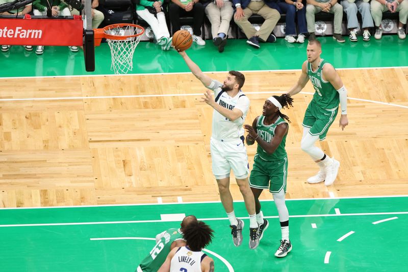 BOSTON, MA - JUNE 17: Maxi Kleber #42 of the Dallas Mavericks drives to the basket during the game against the Boston Celtics during Game 5 of the 2024 NBA Finals on June 17, 2024 at TD Garden in Boston, Massachusetts. NOTE TO USER: User expressly acknowledges and agrees that, by downloading and or using this photograph, User is consenting to the terms and conditions of the Getty Images License Agreement. Mandatory Copyright Notice: Copyright 2024 NBAE  (Photo by Joe Murphy/NBAE via Getty Images)