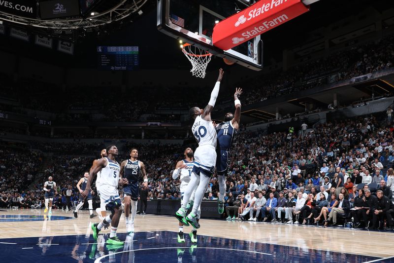 MINNEAPOLIS, MN -  OCTOBER 29: Kyrie Irving #11 of the Dallas Mavericks shoots the ball during the game against the Minnesota Timberwolves on October 29, 2024 at Target Center in Minneapolis, Minnesota. NOTE TO USER: User expressly acknowledges and agrees that, by downloading and or using this Photograph, user is consenting to the terms and conditions of the Getty Images License Agreement. Mandatory Copyright Notice: Copyright 2024 NBAE (Photo by David Sherman/NBAE via Getty Images)