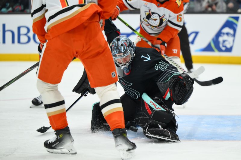 Jan 23, 2026; Seattle, Washington, USA; Seattle Kraken goaltender Philipp Grubauer (31) blocks an Anaheim Ducks goal shot during the first period at Climate Pledge Arena. Mandatory Credit: Steven Bisig-Imagn Images