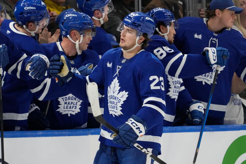 Oct 28, 2025; Toronto, Ontario, CAN; Toronto Maple Leafs forward Matthew Knies (23) celebrates scoring against the Calgary Flames during the second period at Scotiabank Arena. Mandatory Credit: John E. Sokolowski-Imagn Images
