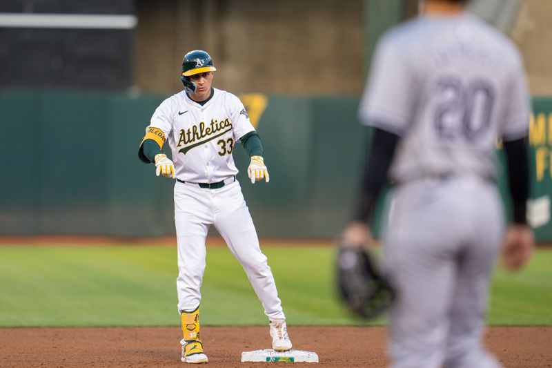 Aug 5, 2024; Oakland, California, USA;  Oakland Athletics center fielder JJ Bleday (33) celebrates at second base Chicago White Sox during the fourth inning at Oakland-Alameda County Coliseum. Mandatory Credit: Neville E. Guard-USA TODAY Sports