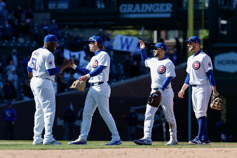 Apr 25, 2024; Chicago, Illinois, USA; Chicago Cubs players celebrate team's win against the Houston Astros at Wrigley Field. Mandatory Credit: Kamil Krzaczynski-USA TODAY Sports