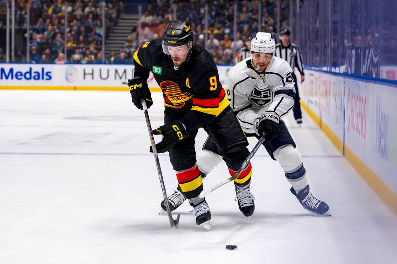 Mar 25, 2024; Vancouver, British Columbia, CAN; Los Angeles Kings forward Kevin Fiala (22) stick checks Vancouver Canucks forward J.T. Miller (9) in the third period at Rogers Arena. Kings won 3 -2. Mandatory Credit: Bob Frid-USA TODAY Sports