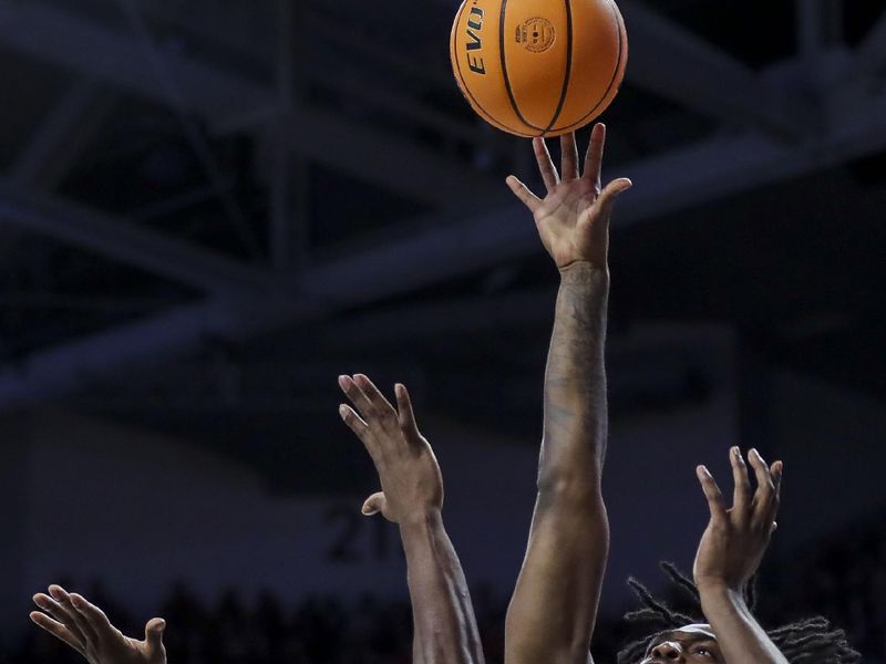 Mar 9, 2024; Cincinnati, Ohio, USA; West Virginia Mountaineers guard Kobe Johnson (2) shoots against Cincinnati Bearcats forward John Newman III (15) in the second half at Fifth Third Arena. Mandatory Credit: Katie Stratman-USA TODAY Sports