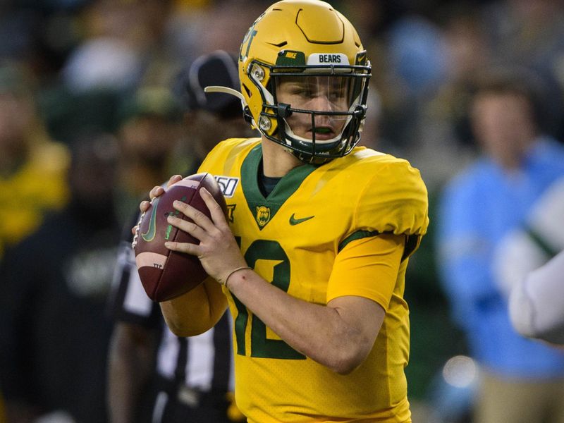 Nov 23, 2019; Waco, TX, USA; Baylor Bears quarterback Charlie Brewer (12) drops back to pass against the Texas Longhorns during the game at McLane Stadium. Mandatory Credit: Jerome Miron-USA TODAY Sports