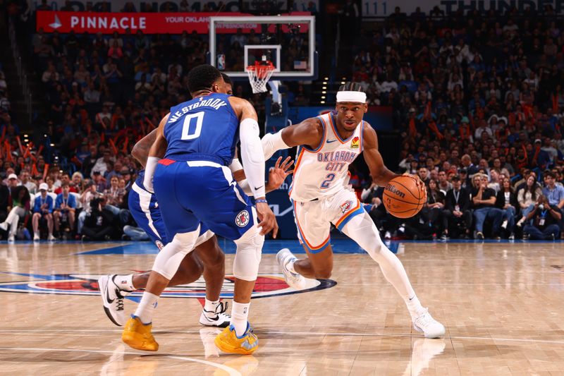 OKLAHOMA CITY, OK - FEBRUARY 22:  Shai Gilgeous-Alexander #2 of the Oklahoma City Thunder handles the ball during the game against the LA Clippers on February 22SF, 2024 at Paycom Arena in Oklahoma City, Oklahoma. NOTE TO USER: User expressly acknowledges and agrees that, by downloading and or using this photograph, User is consenting to the terms and conditions of the Getty Images License Agreement. Mandatory Copyright Notice: Copyright 2024 NBAE (Photo by Zach Beeker/NBAE via Getty Images)