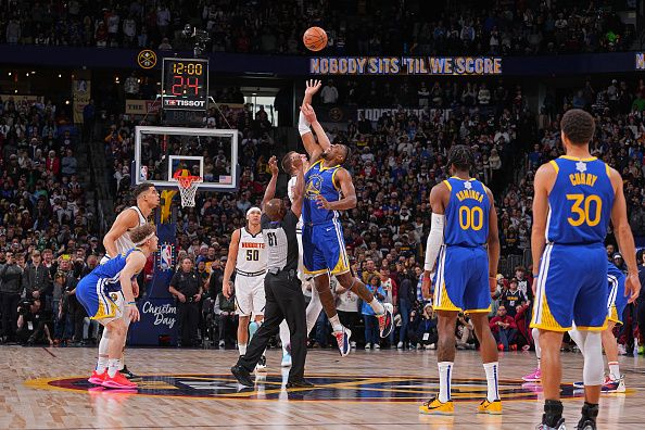 DENVER, CO - DECEMBER 25: Tip-off during the game between the Golden State Warriors and Denver Nuggets on December 25, 2023 at the Ball Arena in Denver, Colorado. NOTE TO USER: User expressly acknowledges and agrees that, by downloading and/or using this Photograph, user is consenting to the terms and conditions of the Getty Images License Agreement. Mandatory Copyright Notice: Copyright 2023 NBAE (Photo by Bart Young/NBAE via Getty Images)