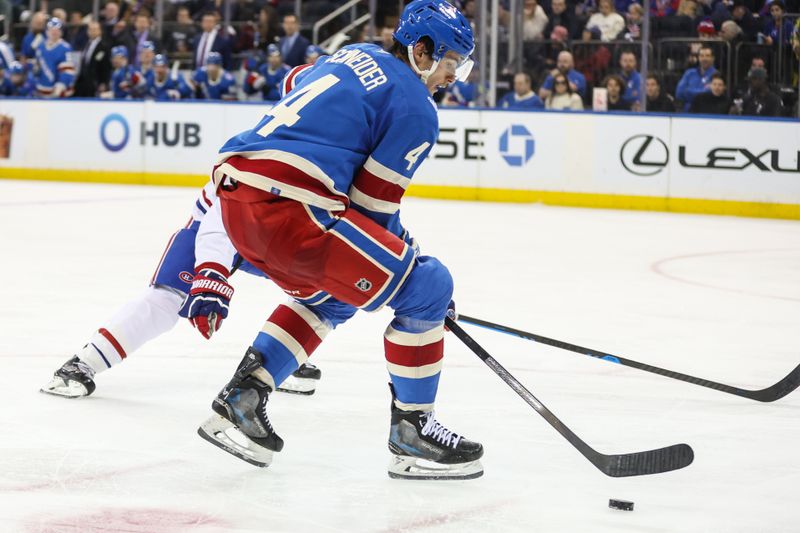 Dec 13, 2025; New York, New York, USA;  New York Rangers defenseman Braden Schneider (4) controls the puck in the third period against the Montréal Canadiens at Madison Square Garden. Mandatory Credit: Wendell Cruz-Imagn Images