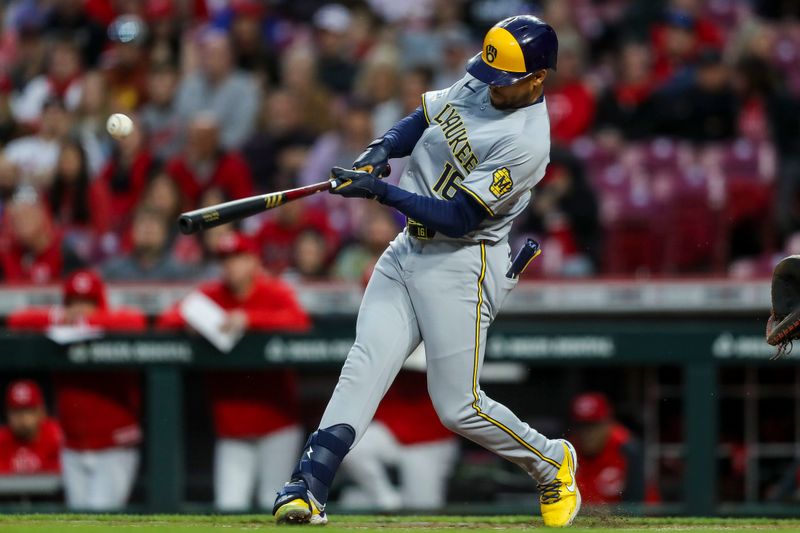 Apr 9, 2024; Cincinnati, Ohio, USA; Milwaukee Brewers outfielder Blake Perkins (16) hits a two-run single against the Cincinnati Reds in the third inning at Great American Ball Park. Mandatory Credit: Katie Stratman-USA TODAY Sports