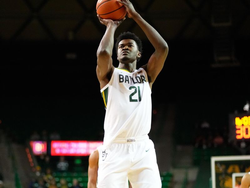 Nov 28, 2023; Waco, Texas, USA;  Baylor Bears center Yves Missi (21) makes a free throw against the Nicholls State Colonels during the first half at Ferrell Center. Mandatory Credit: Chris Jones-USA TODAY Sports