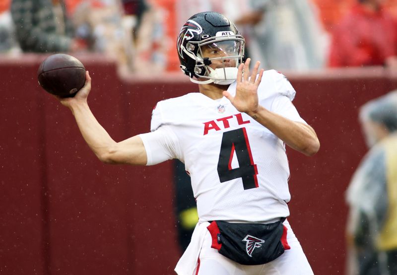 FILE - Atlanta Falcons quarterback Desmond Ridder (4) throws before an NFL football game against the Washington Commanders on Nov. 27, 2022, in Landover, Md. The Atlanta Falcons will have more on the line than retaining hope in the weak NFC South race as rookie quarterback Ridder makes his debut as the starter on Sunday, Dec. 18, at New Orleans. (AP Photo/Daniel Kucin Jr., File)