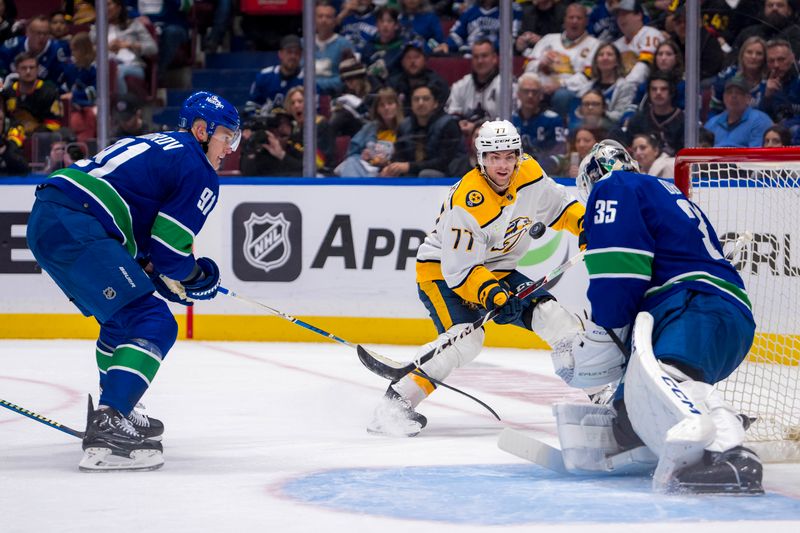 Apr 21, 2024; Vancouver, British Columbia, CAN; Vancouver Canucks defenseman Nikita Zadorov (91) and goalie Thatcher Demko (35) and Nashville Predators forward Luke Evangelista (77) watch the rebound in the second period in game one of the first round of the 2024 Stanley Cup Playoffs at Rogers Arena. Mandatory Credit: Bob Frid-USA TODAY Sports