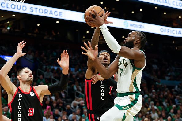 Boston, MA - November 28: Boston Celtics SG Jaylen Brown is defended by Chicago Bulls SF Torrey Craig in the second half. The Celtics beat the Bulls, 124-97. (Photo by Danielle Parhizkaran/The Boston Globe via Getty Images)