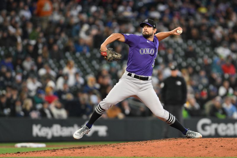 Apr 16, 2023; Seattle, Washington, USA; Colorado Rockies relief pitcher Brad Hand (55) pitches to the Seattle Mariners during the sixth inning at T-Mobile Park. Mandatory Credit: Steven Bisig-USA TODAY Sports