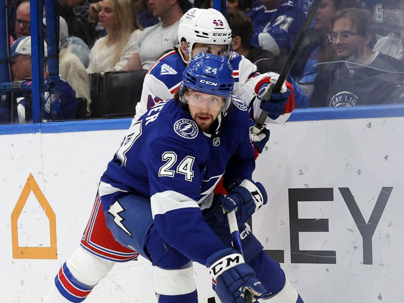 Nov 12, 2025; Tampa, Florida, USA; Tampa Bay Lightning defenseman Max Crozier (24) skates with the puck as New York Rangers left wing Conor Sheary (43) defends during the second period at Benchmark International Arena. Mandatory Credit: Kim Klement Neitzel-Imagn Images