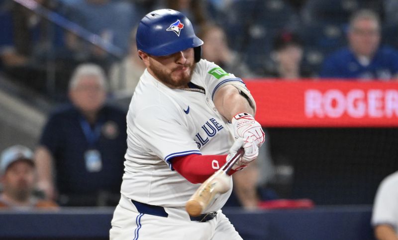 May 14, 2025; Toronto, Ontario, CAN;  Toronto Blue Jays catcher Alejandro Kirk (30) hits a three run home run against the Tampa Bay Rays in the sixth inning at Rogers Centre. Mandatory Credit: Dan Hamilton-Imagn Images